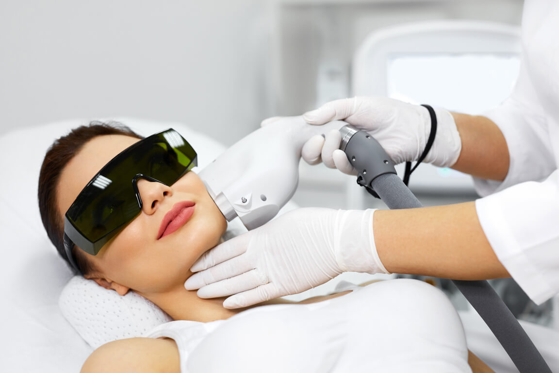 cosmetology-beautiful-woman-receiving-laser-hair-580664962