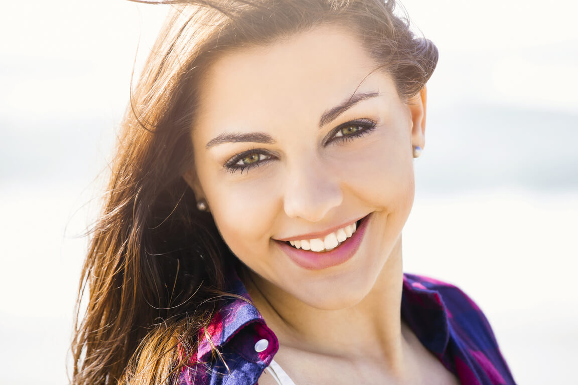 portrtait-happy-girl-beach-smilling-290465765
