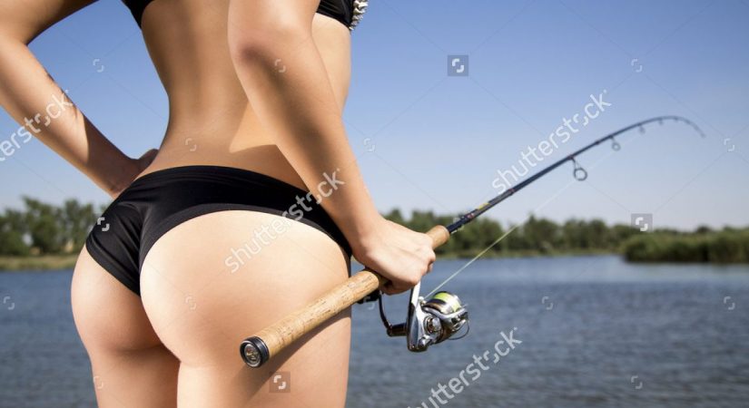 sexy-woman-spinning-fishing-predator-480590137